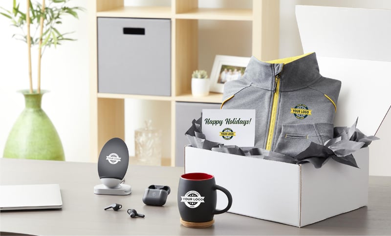 Happy holidays gift box of promotional products on a client's desk