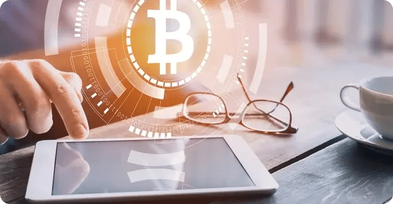 cryptocurrency-bitcoin-hand-pointing-at-tablet
