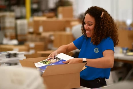 emplyee-placing-brochures-in-box_new-shirt