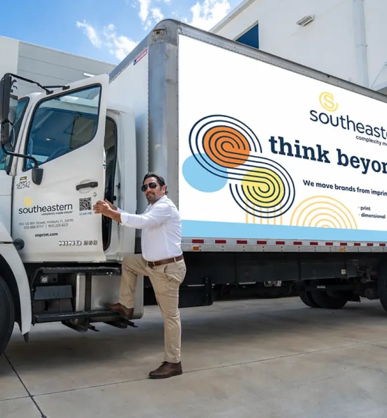 man-getting-into-branded-truck-cropped