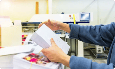 placing-rubberband-around-stack-of-mail