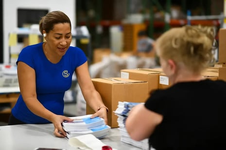 print-management-woman-sorting_new-shirt